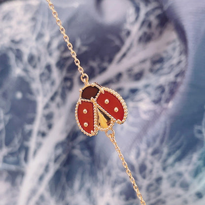 [GALE] Armband mit Glücksfedermotiv 1, rosa-golden