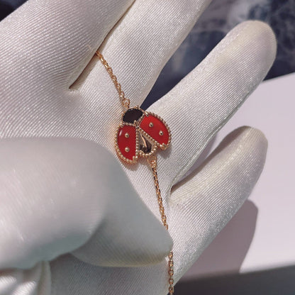 [GALE] Armband mit Glücksfedermotiv 1, rosa-golden